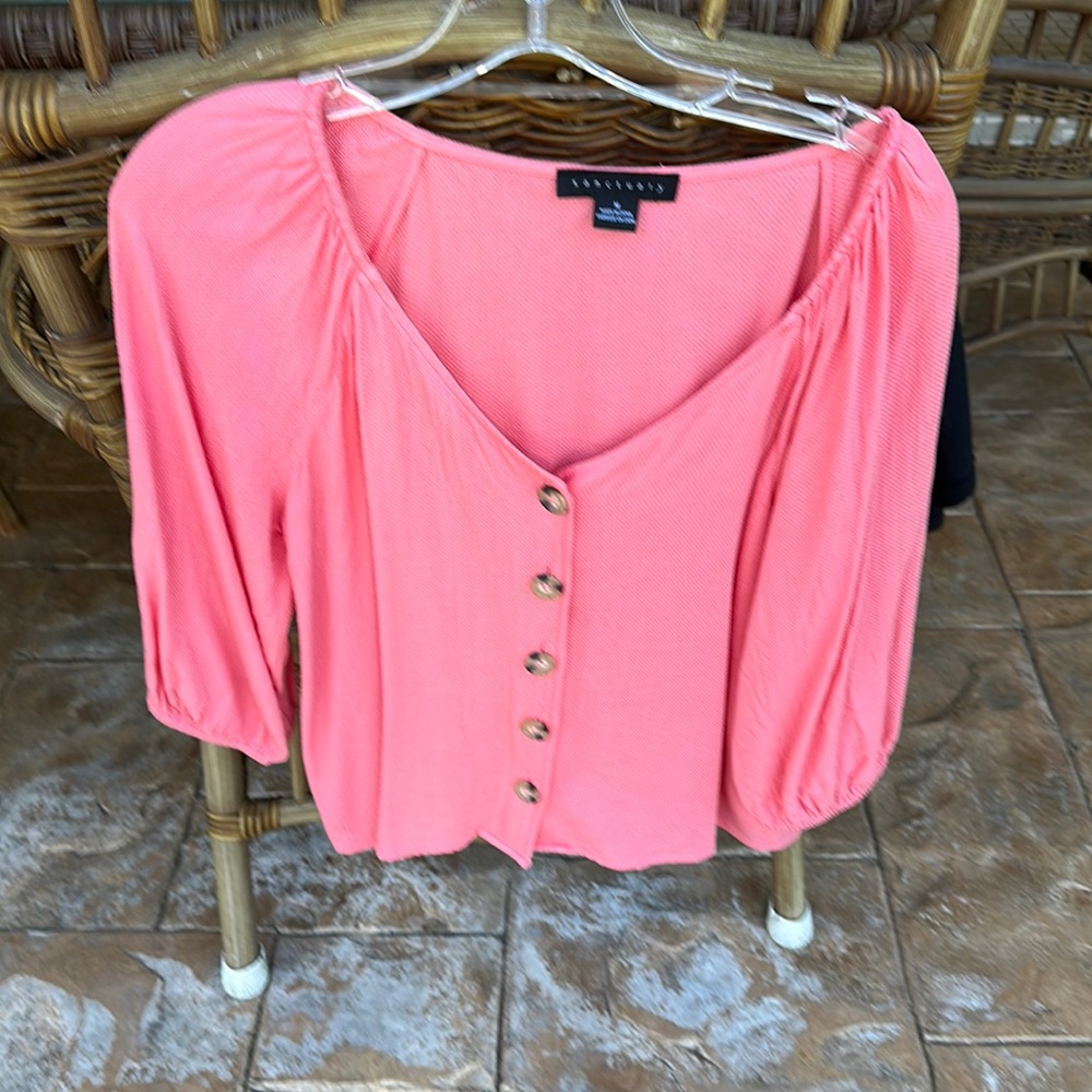 Sanctuary top looks pink in photo but definitely salmon color.